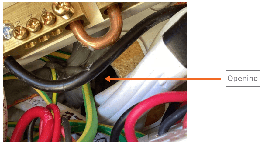 A photograph of a switchboard with a wide opening. A graphic arrow element points at the opening, marked 'opening'.