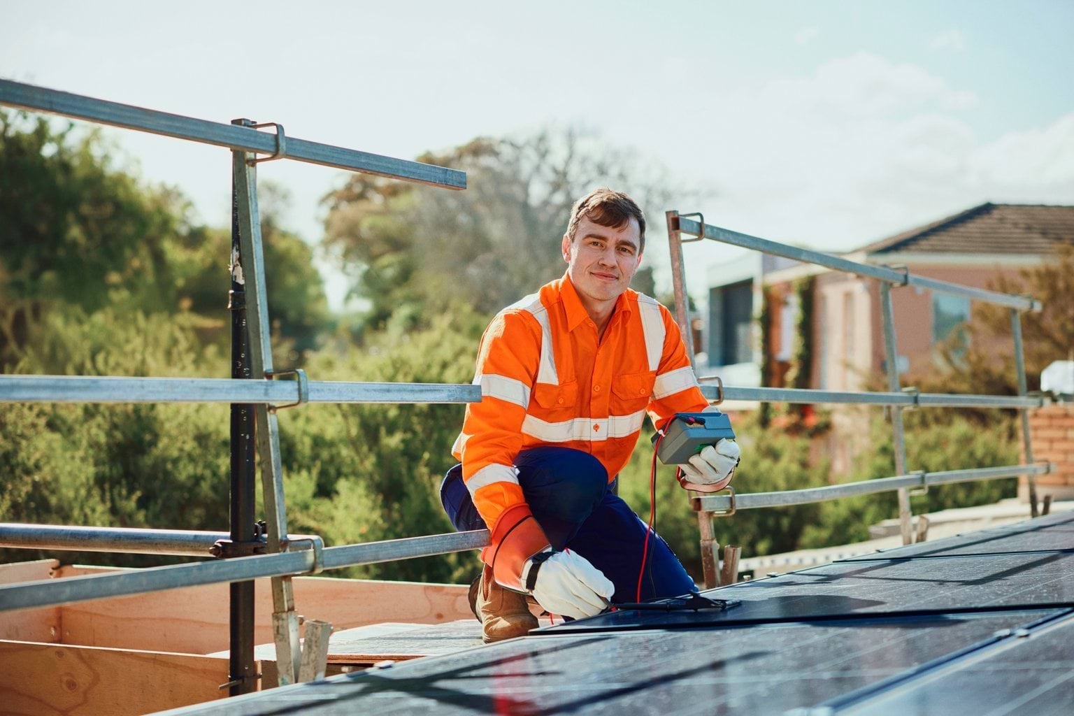 A Grade electrician servicing solar panels